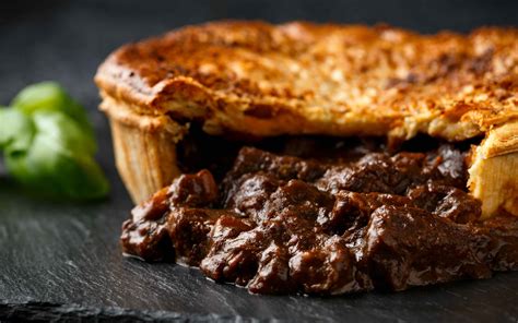   Steak and Ale Pie: Savoring the Richness of Tender Beef Stewed in Dark Beer with a Flaky Pastry Lid!